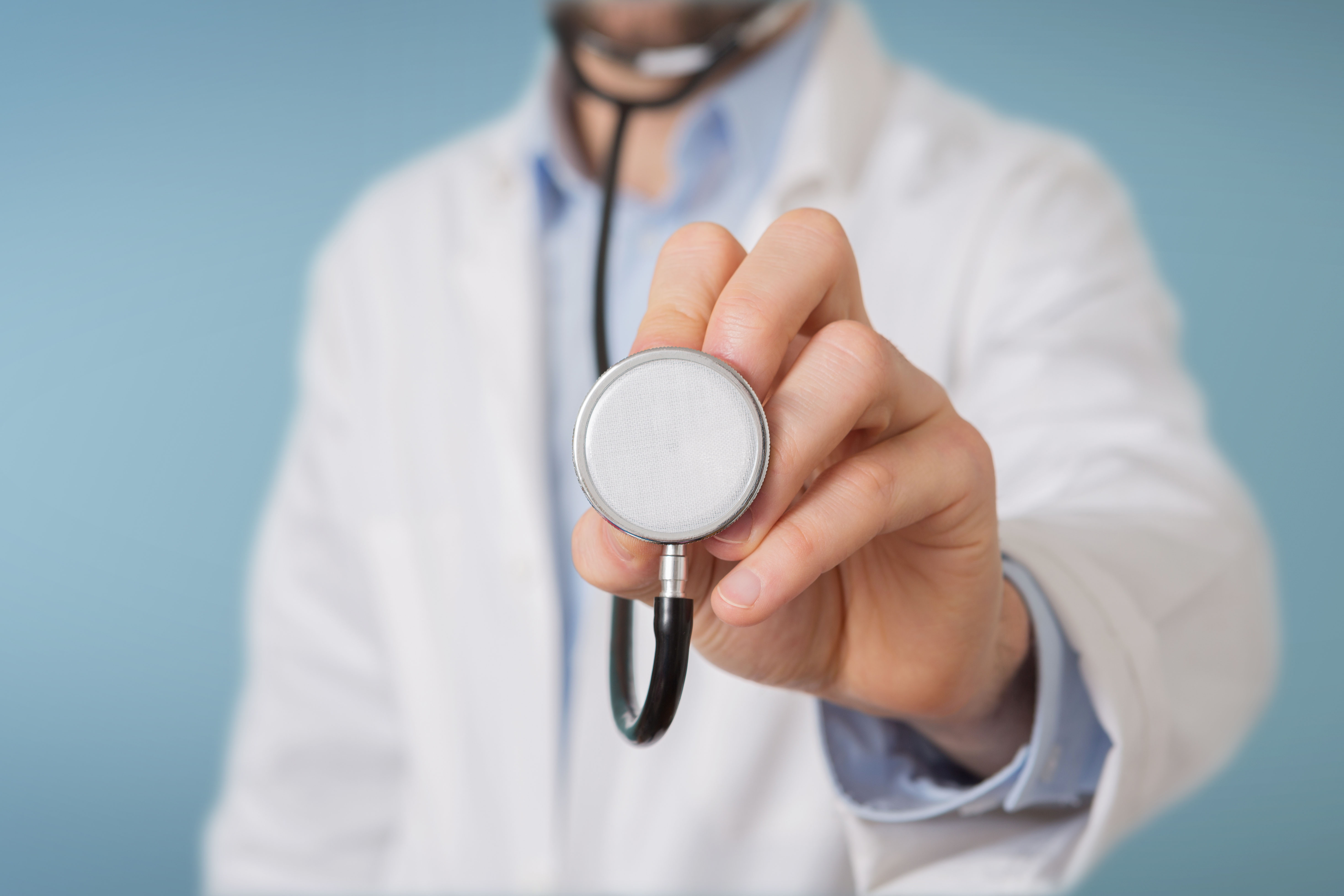 Man holding a stethoscope